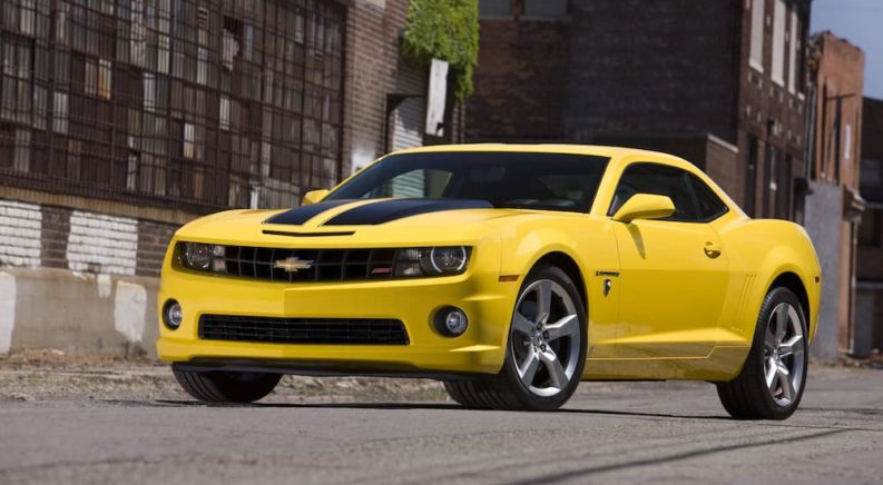 A yellow 2010 Chevy Camaro SS Transformers Edition is shown from the front at an angle.