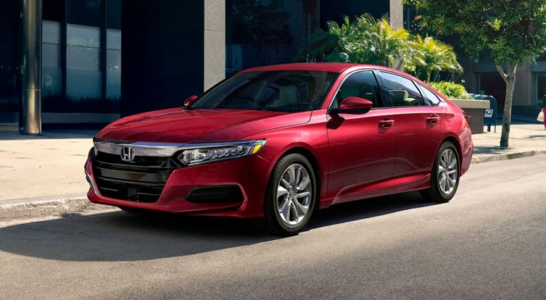A red 2020 Honda Accord LX is shown parked on a city street.