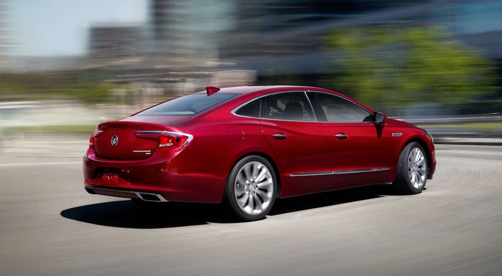 A red 2019 Buick LaCrosse is shown leaving a used Buick dealer.
