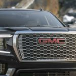 A black 2023 GMC Yukon Denali Ultimate is shown from the front.