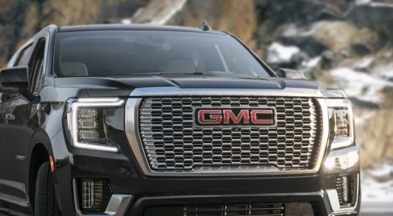 A black 2023 GMC Yukon Denali Ultimate is shown from the front.