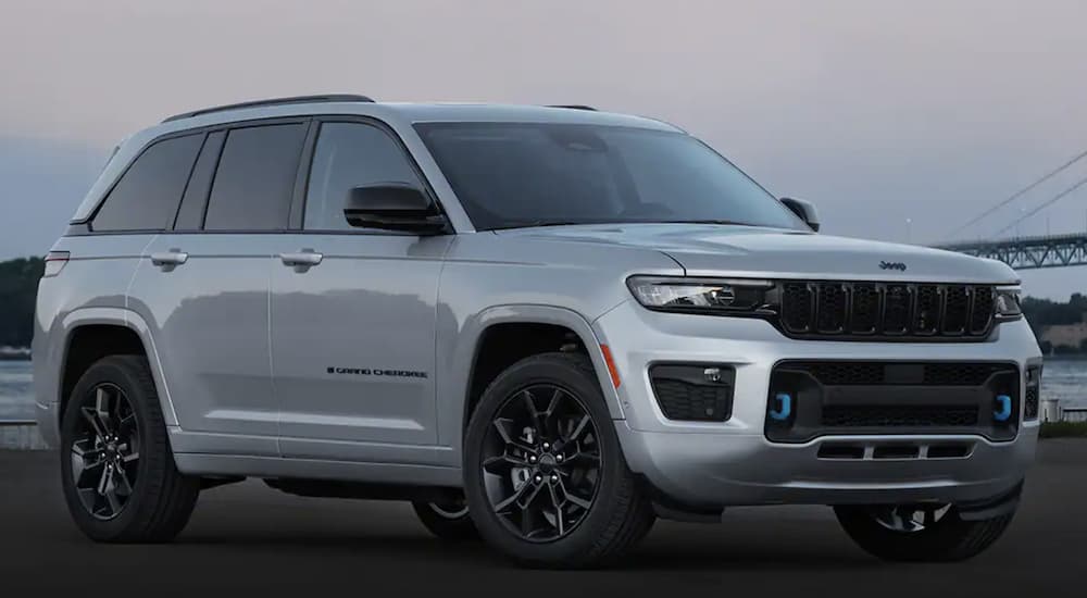 A grey 2023 Jeep Grand Cherokee 4xe is shown angled right.