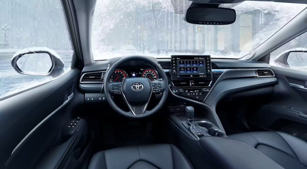The interior of a 2022 Toyota Camry is shown from the driver's seat.