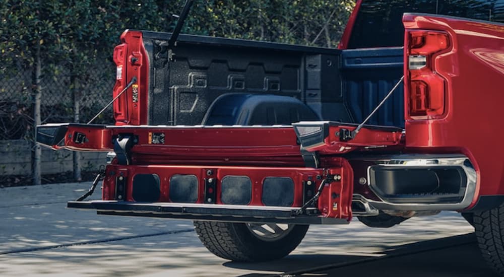 The rear of a red 2022 Chevy Silverado 1500 LTZ is shown in close up.