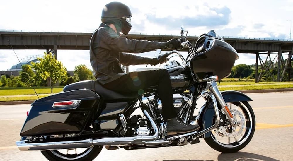 A black 2022 Harley-Davidson Road Glide is shown from the side.