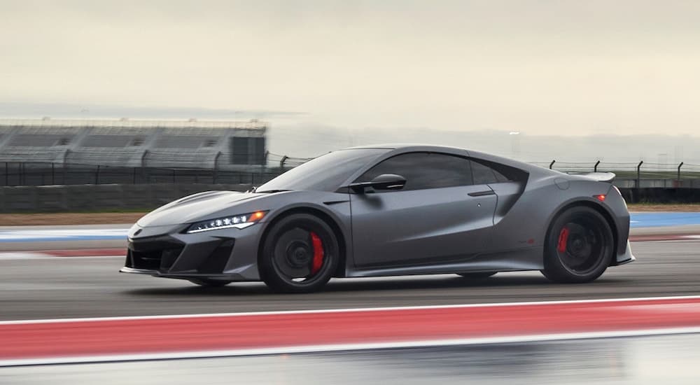 A grey 2022 Acura NSX Type S is shown from the side on a racetrack.
