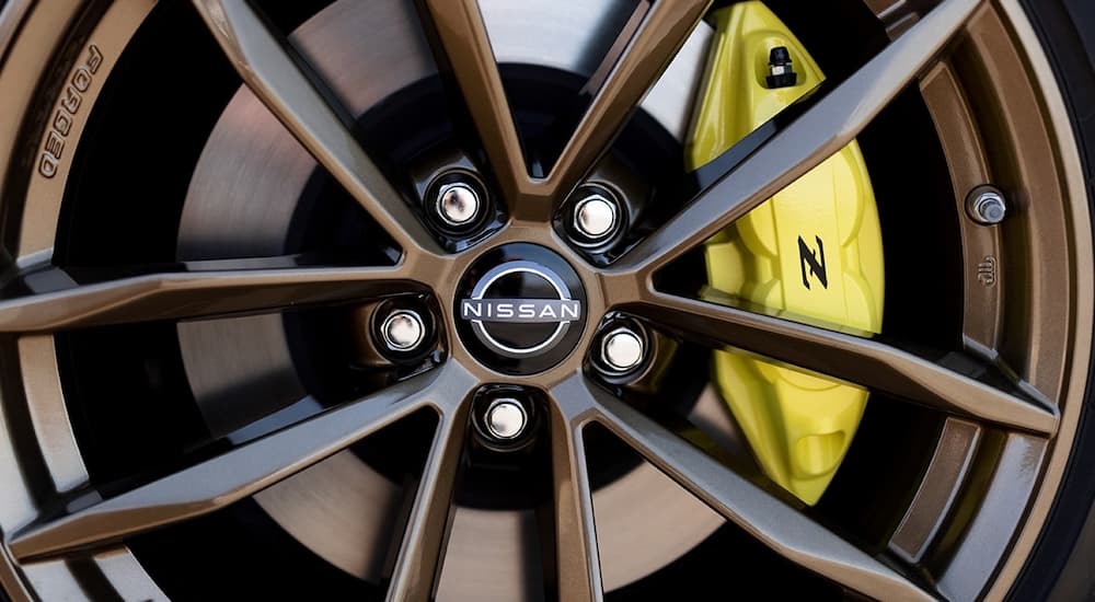 A close up of the rim of a 2023 Nissan Z is shown at a Nissan dealer.