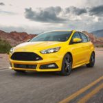 A yellow 2017 Ford Focus ST is shown from the front at an angle.