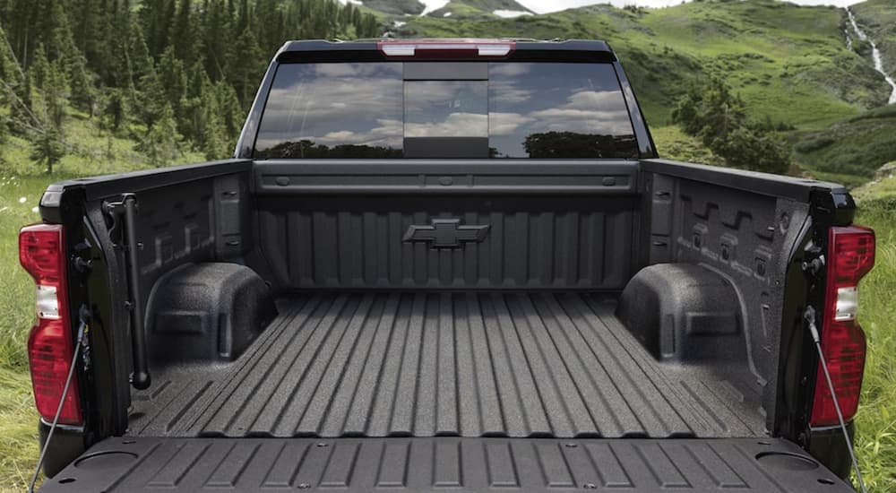 The bed of a 2023 Chevy Silverado 1500 is shown in close up.