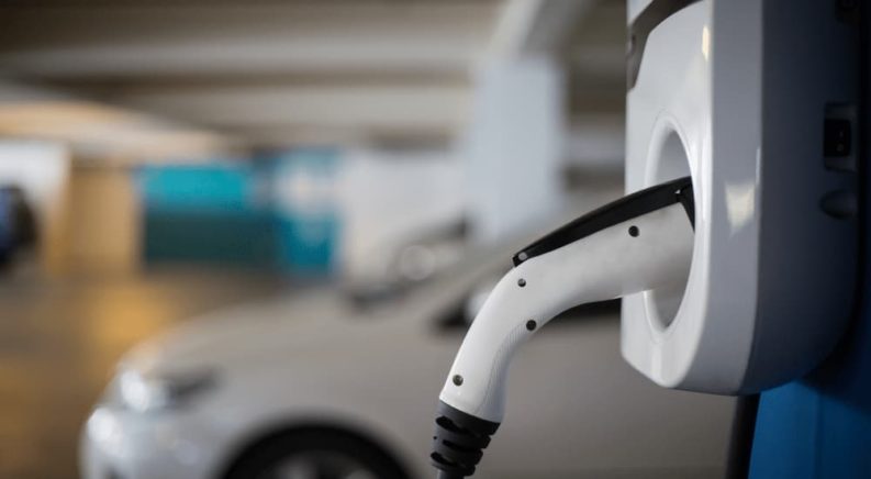 A white EV charger is shown at a Honda dealer.