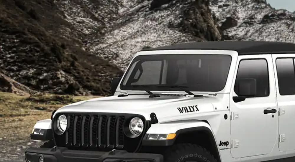 A white 2022 Jeep Gladiator Willys is shown from the front in close up.