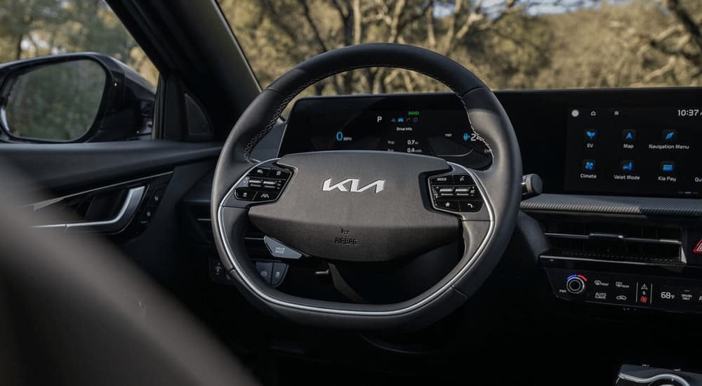 A close up of the steering wheel in a 2023 Kia EV6 is shown.