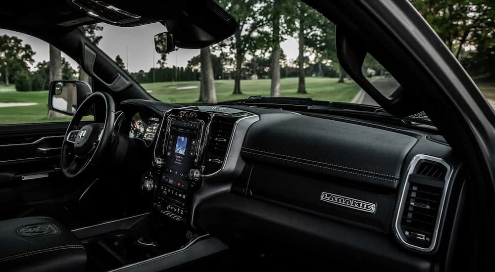 The interior of a 2022 Ram 1500 is shown from the passenger side.