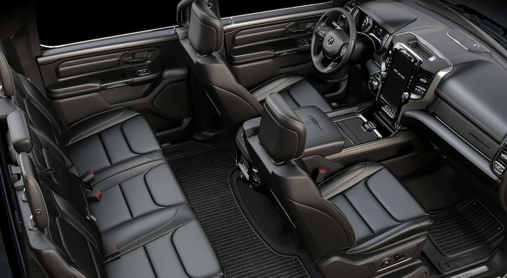 The black interior of a 2022 Ram 1500 is shown from a high angle.