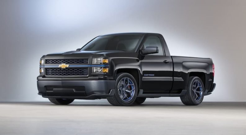 A black 2013 Silverado Cheyenne is shown from the side at a truck dealership near you.