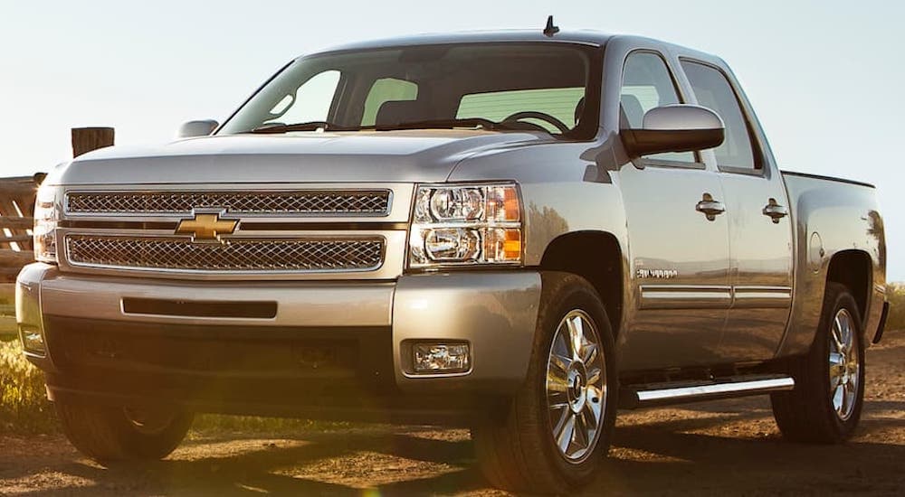 A silver 2013 Chevy Silverado 1500 is shown from the front.