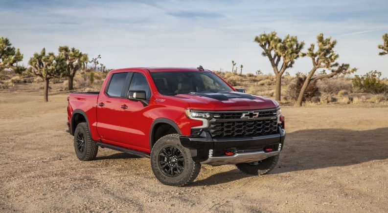 A red 2022 Chevy Silverado 1500 ZR2 is shown from the front at an angle.