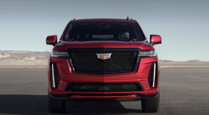 A red 2023 Cadillac Escalade V is shown from the front.