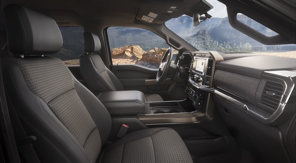 The interior of a 2023 Ford F-150 Rattler is shown from the passenger seat.