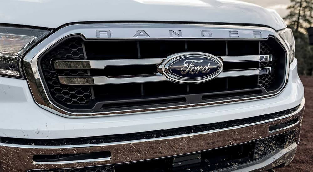 A close up of the grille of a white 2023 Ford Ranger.