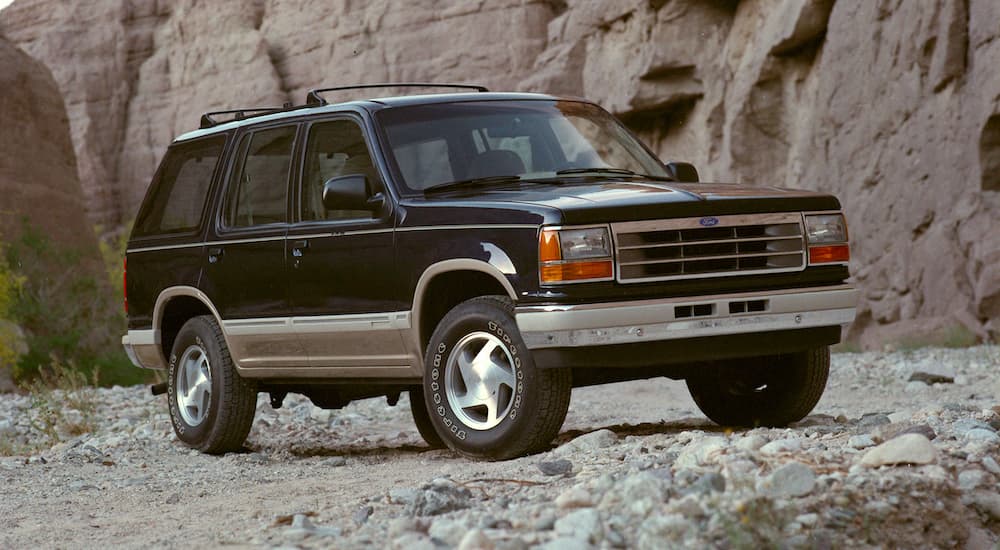 A black 1991 Ford Explorer is shown from the side after leaving a used Ford dealership.