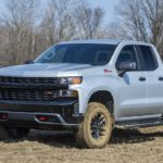 A grey 2022 Chevy Silverado Custom Trail Boss is shown from the front at an angle after leaving a Chevy Silverado 1500 dealer.