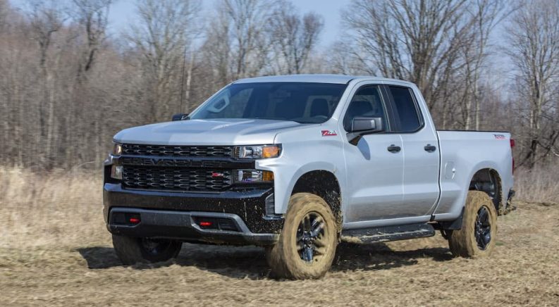 A grey 2022 Chevy Silverado Custom Trail Boss is shown from the front at an angle after leaving a Chevy Silverado 1500 dealer.