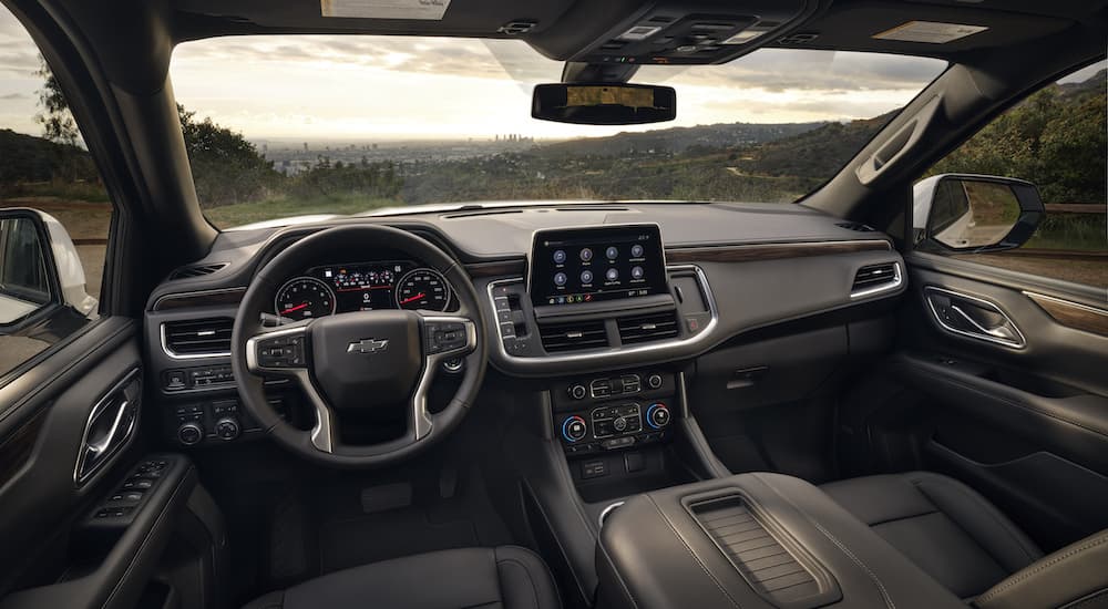 The black interior of a 2023 Chevy Tahoe Z71 is shown from the drivers seat.