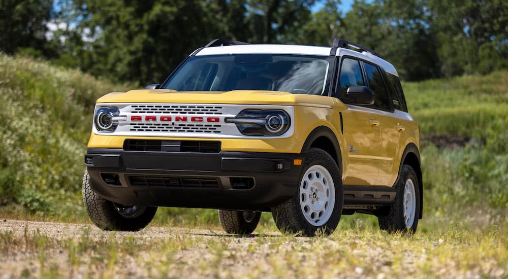 A yellow 2023 Ford Bronco Sport Heritage Edition is shown from the front at an angle.