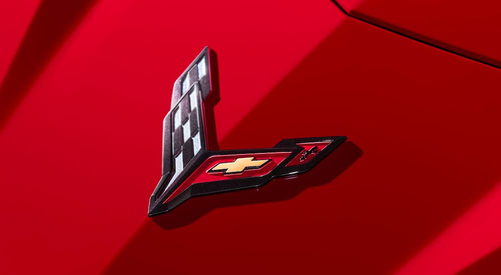 A close up shows the hood badge on a 2023 Chevy Corvette Stingray.