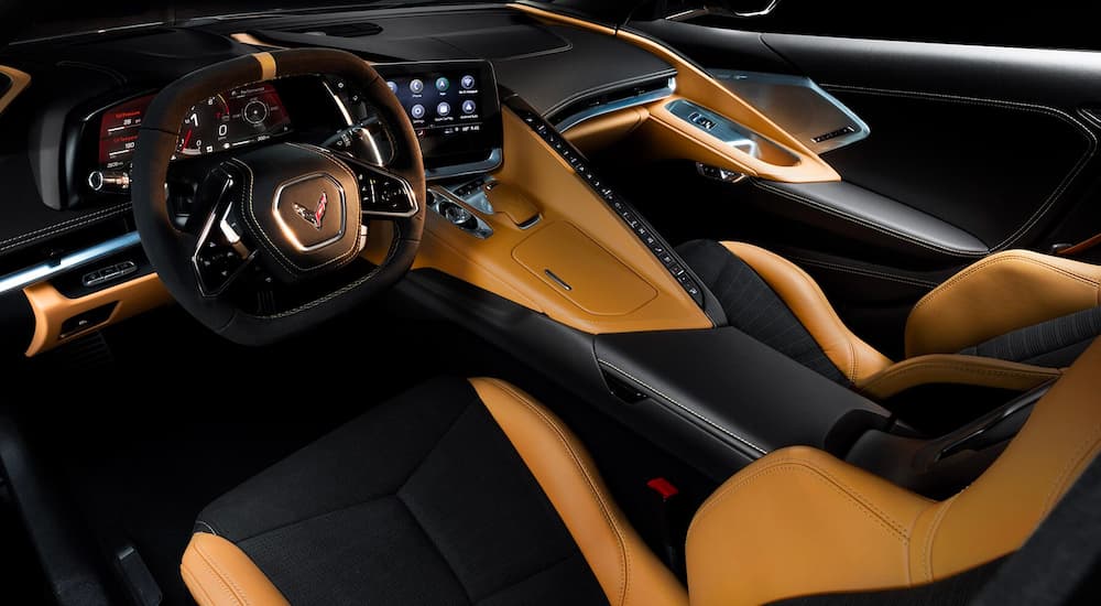 The tan and black interior is show in a 2023 Chevy Corvette Stingray.