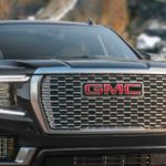A close up shows the grille on a black 2023 GMC Yukon Denali Ultimate.