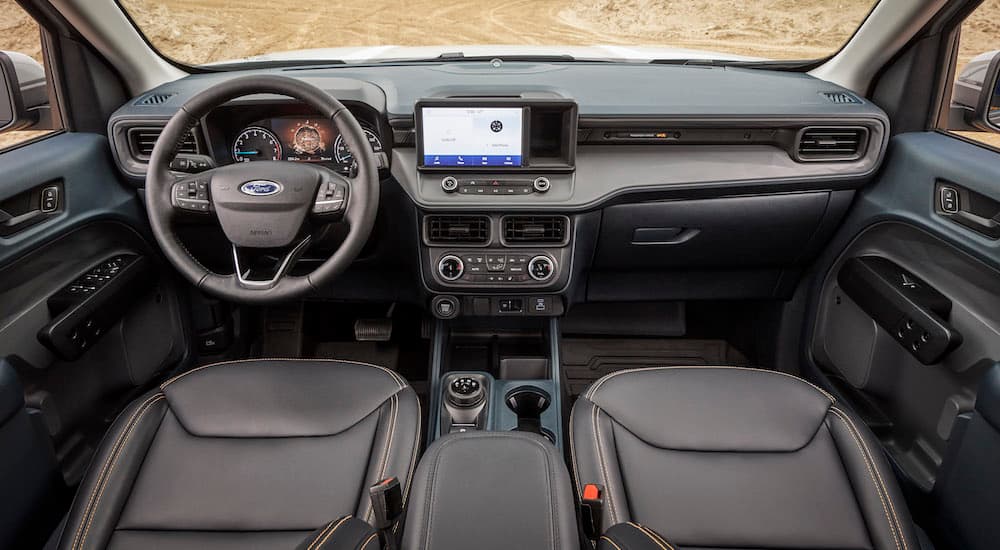 The black interior of a 2023 Ford Maverick Tremor is shown from above the center console.