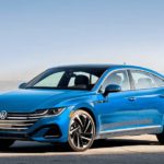 A blue 2023 Volkswagen Arteon is shown parked in a empty lot.