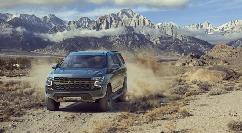 A grey 2023 Chevy Tahoe Z71 is shown from the front while off-road.