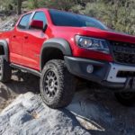 A red 2019 Chevy Colorado ZR2 is shown from the front at an angle after leaving a dealer that has used trucks for sale.