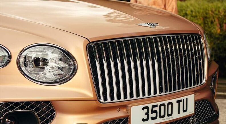 A close up of the grille on a tan 2023 Bentley Bentayaga EWB is shown.