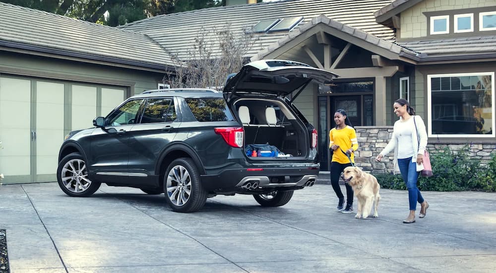 A dark blue 2023 Ford Explorer is shown in a driveway.