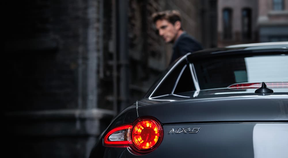 A close up shows the driver side taillight on a grey 2023 Mazda MX-5 Miata RF.