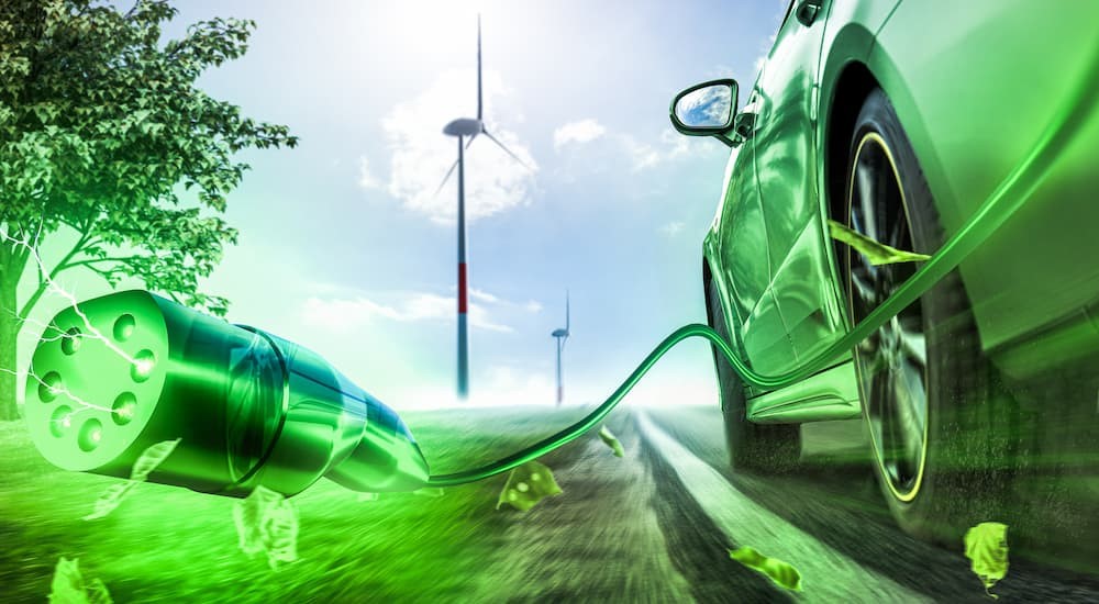 A 3D rendering of an electric car utilizing green energy is shown.