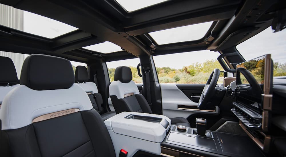 The black and white interior is shown inside a 2024 GMC Hummer EV.