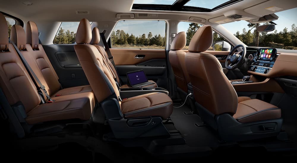 The brown interior of a 2023 Nissan Pathfinder is shown at a Nissan Pathfinder dealer.