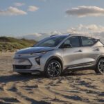 A silver 2022 Chevy Bolt EUV is shown from the side while off-road.
