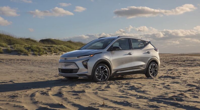 A silver 2022 Chevy Bolt EUV is shown from the side while off-road.