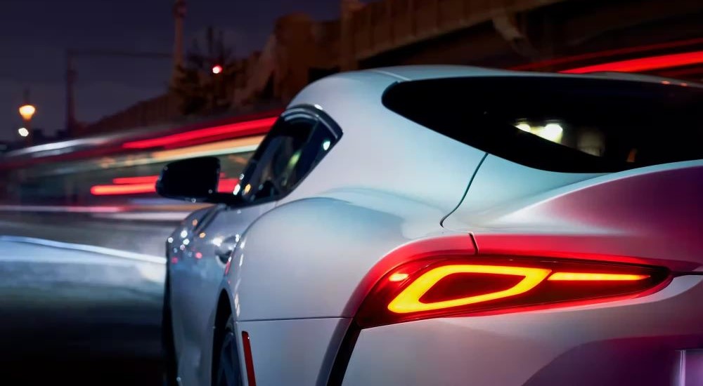 A close up shows the driver side taillight on a white 2023 Toyota GR Supra.