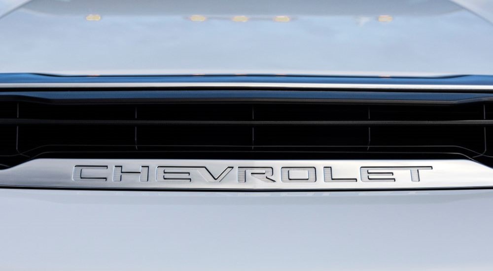 A close up shows the hood vent on a white 2024 Chevy Silverado 3500HD LTZ.