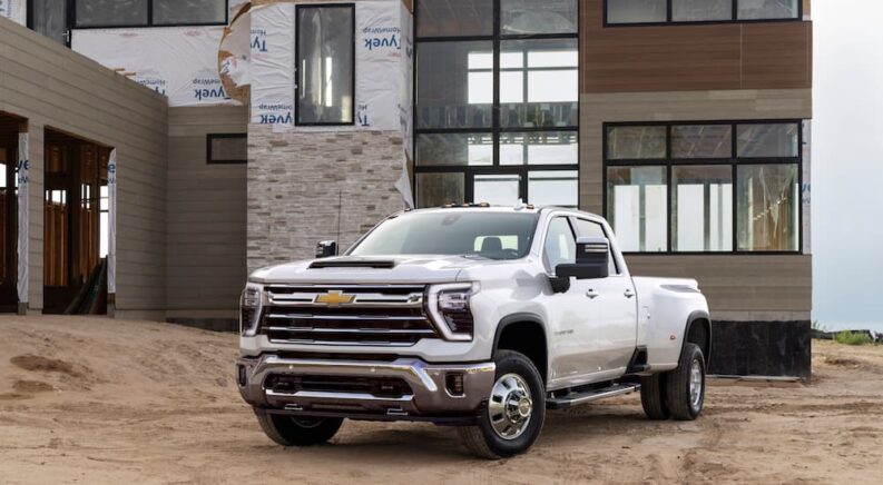 A white 2024 Chevy Silverado 3500 HD is shown from the front at an angle.