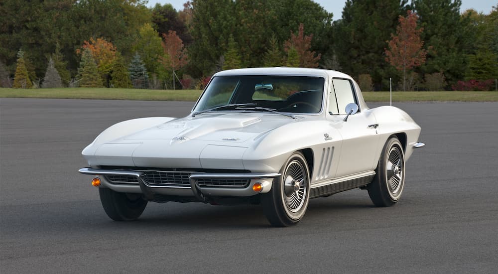 A white 1966 Chevy Corvette is shown parked.