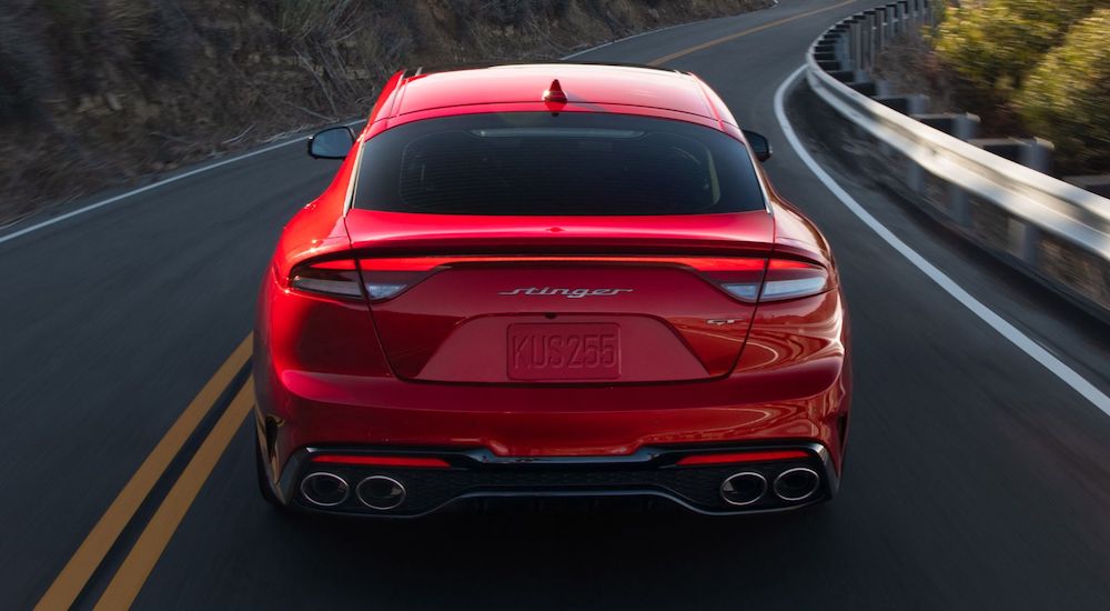 A red 2023 Kia Stinger GT is shown from the rear.