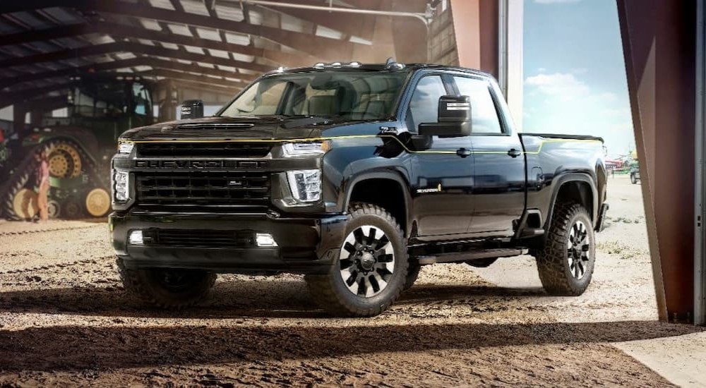 A black 2021 Chevy Silverado Carhartt Special Edition is shown parked in a barn.